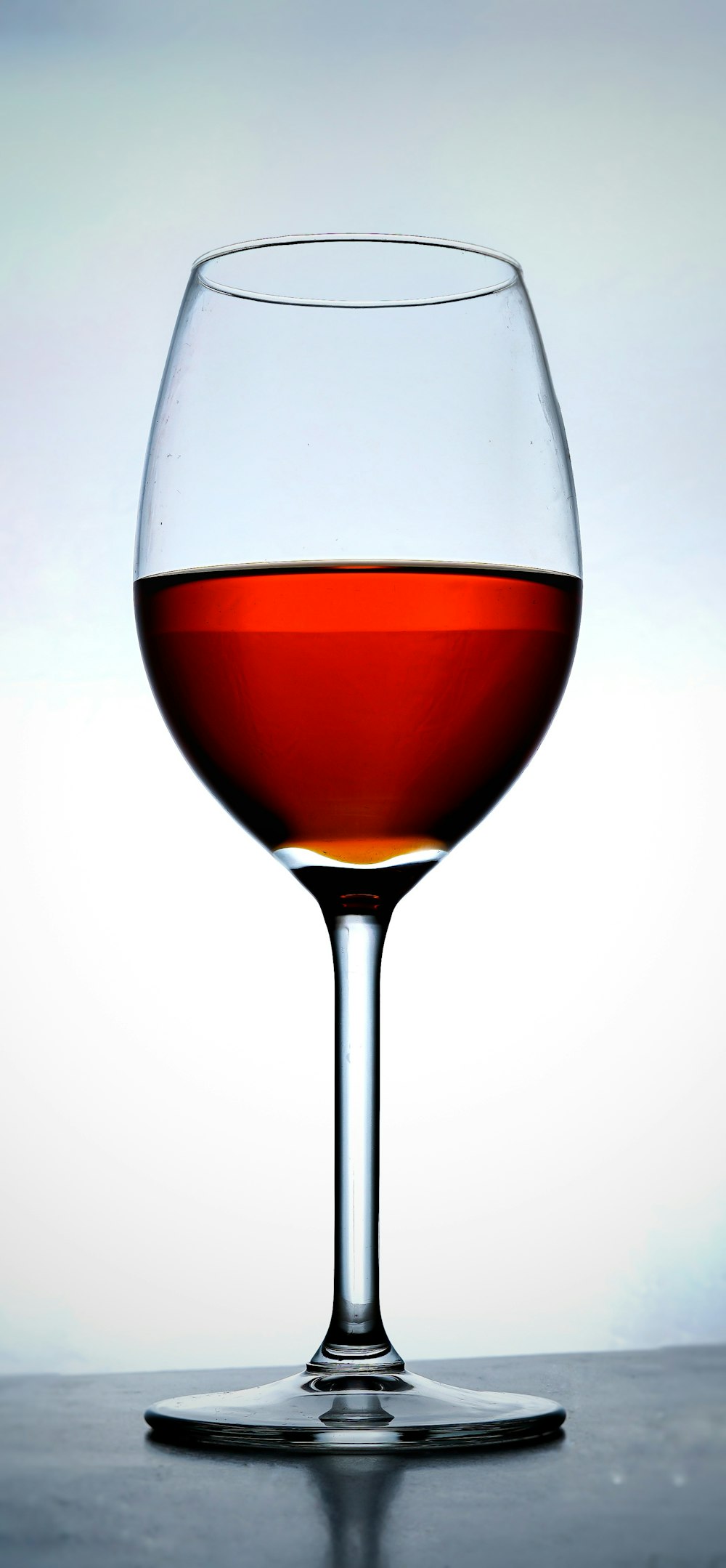 clear wine glass with red wine