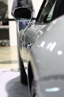 Side view of a microcar with a deep shine on the paintwork under subtle lighting