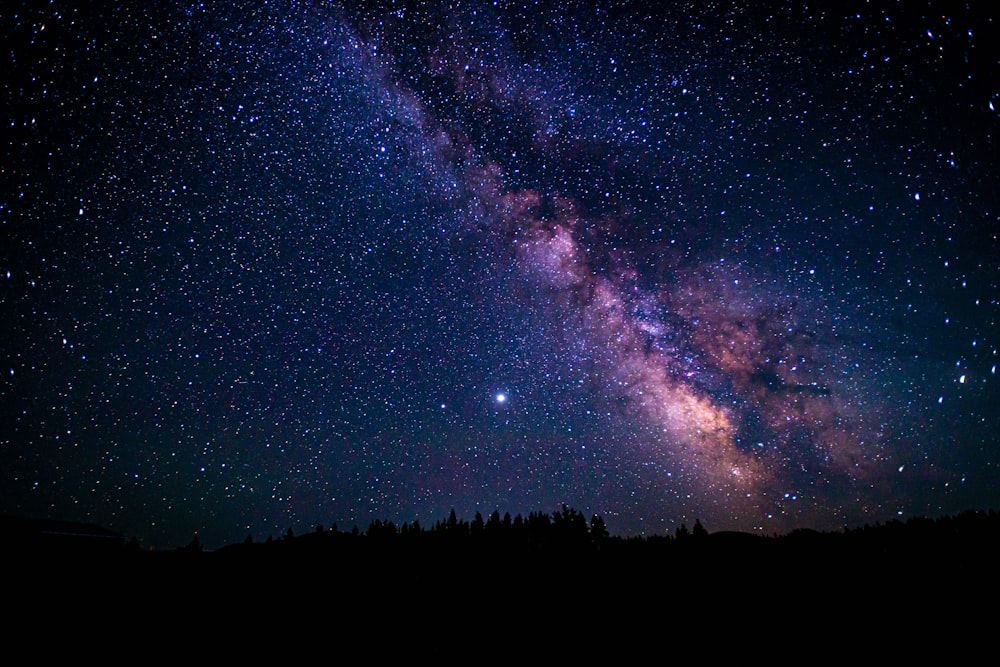 blue and black sky with stars during night time