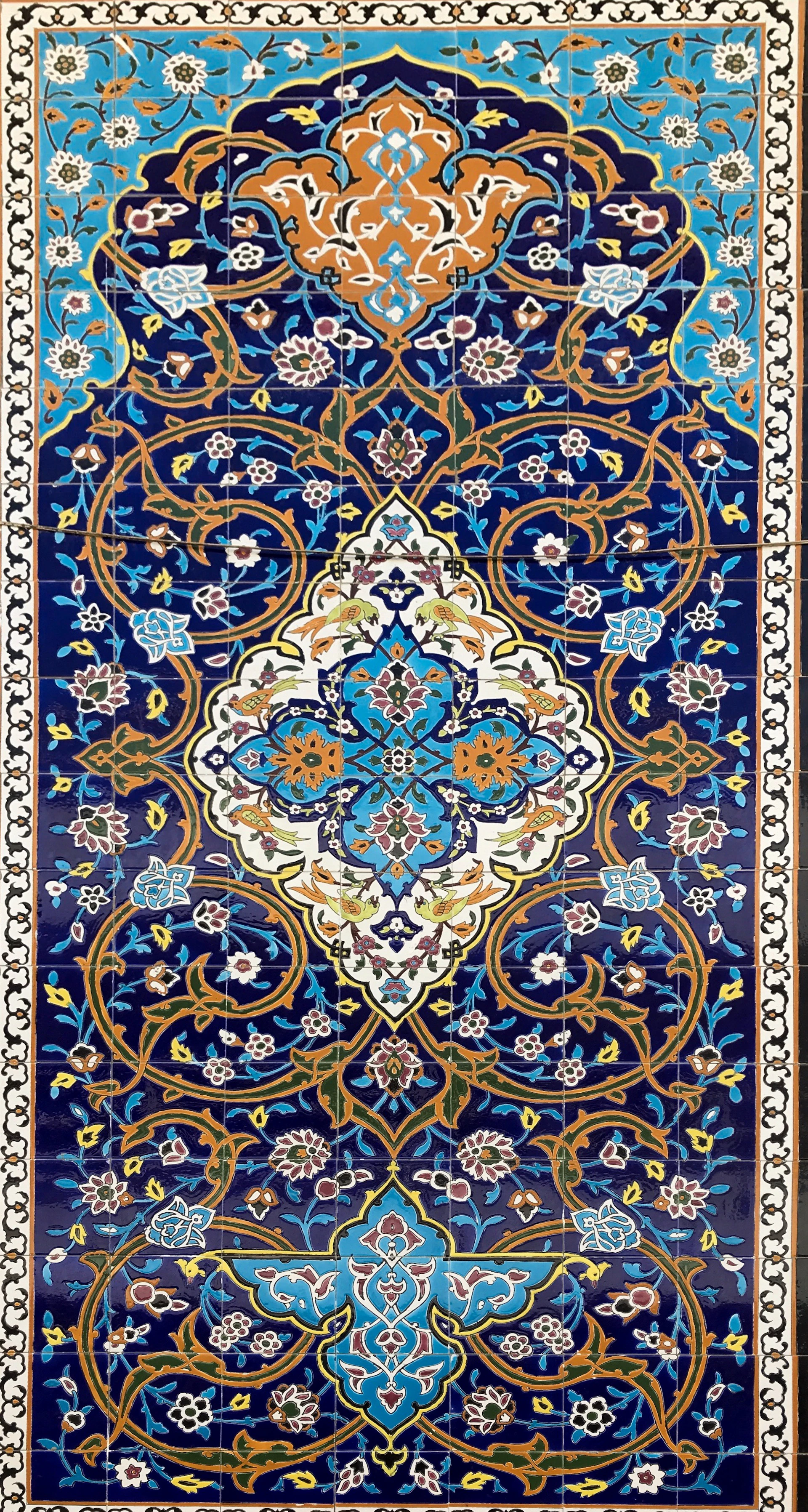 brown white and black floral textile