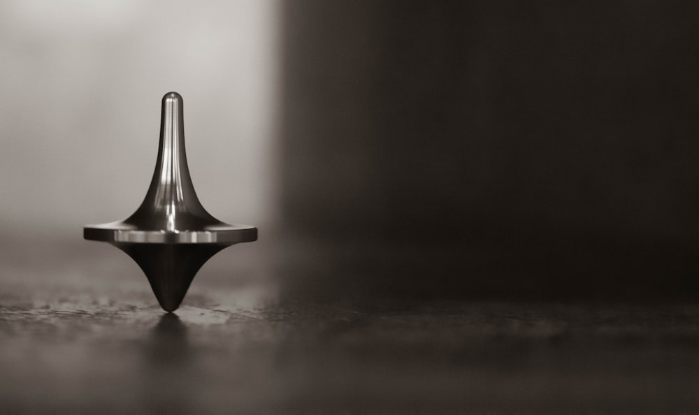 gold pyramid on brown wooden table