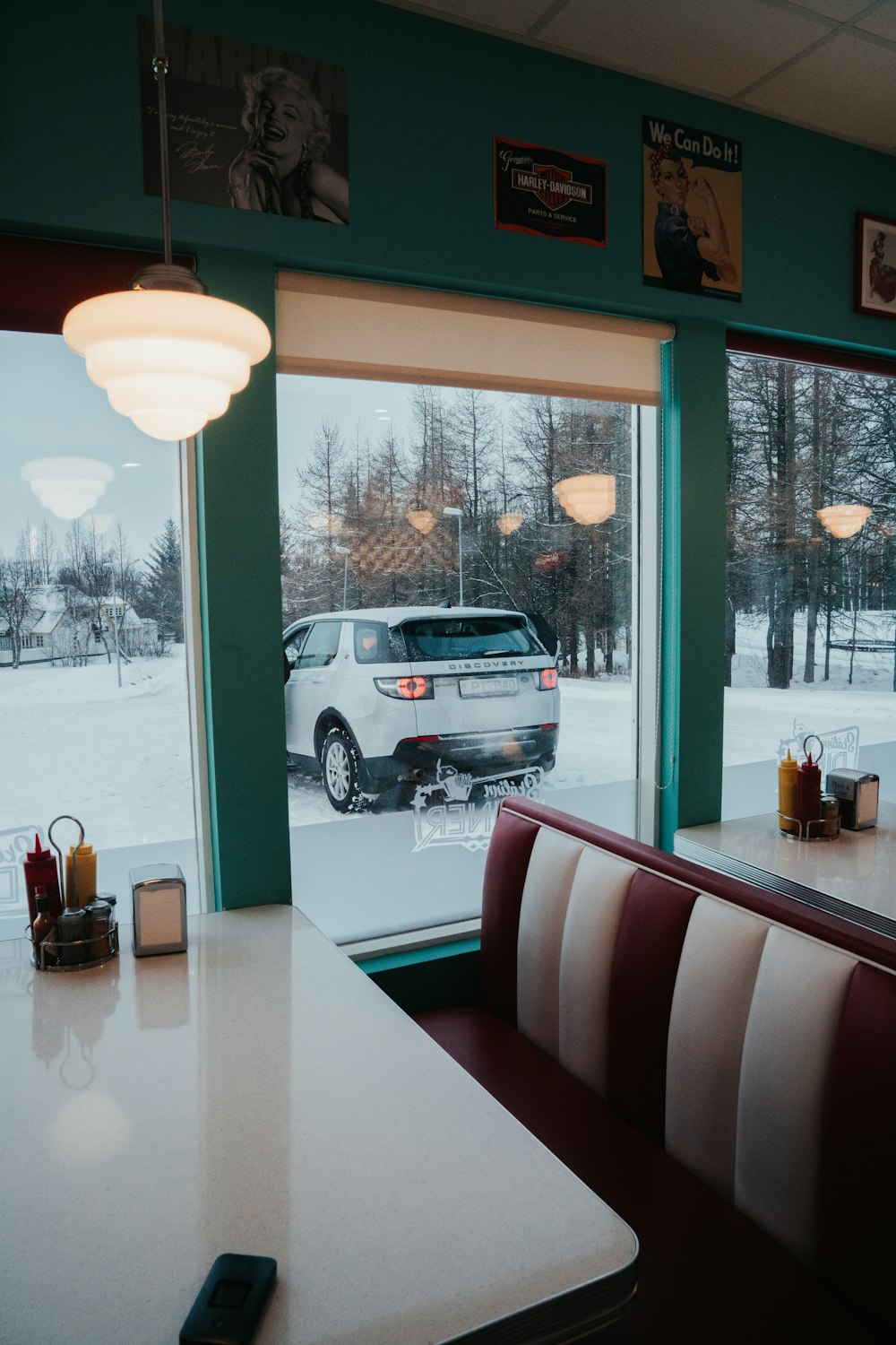 black suv parked near glass window during daytime