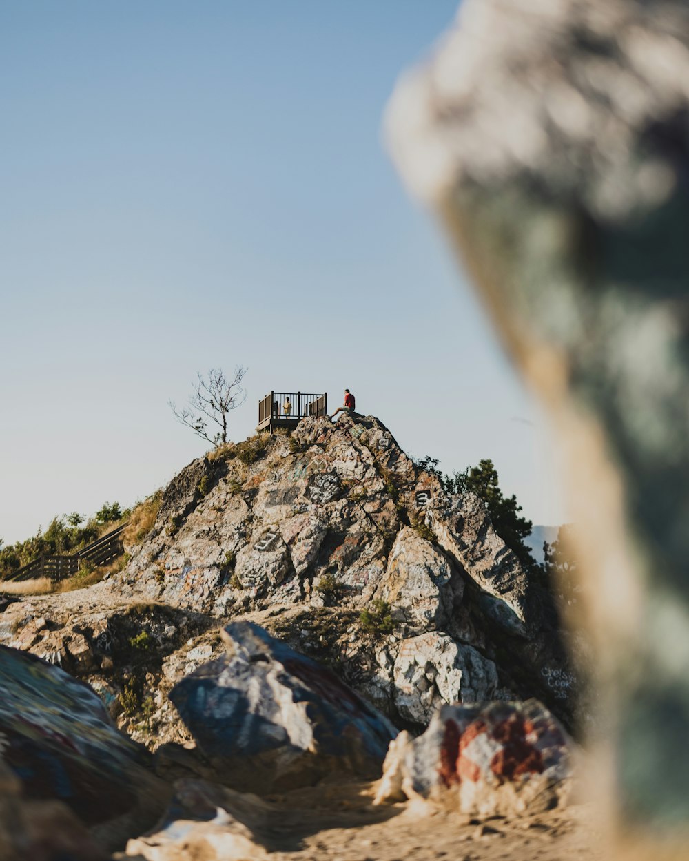 person standing on rock formation during daytime