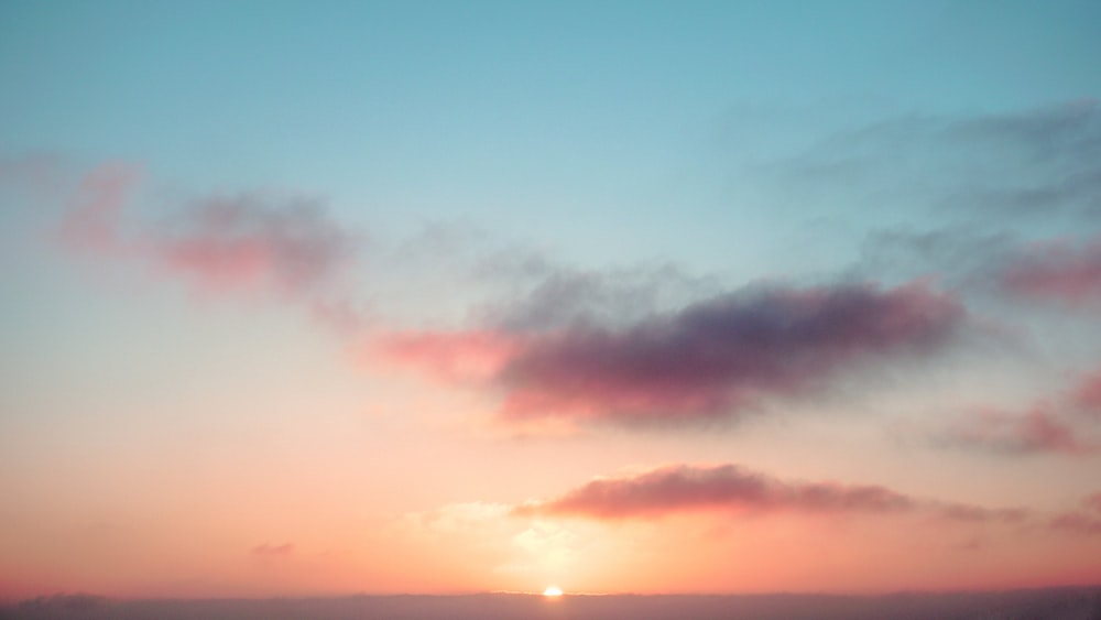 orange and blue cloudy sky during sunset