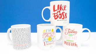 white and black ceramic mug