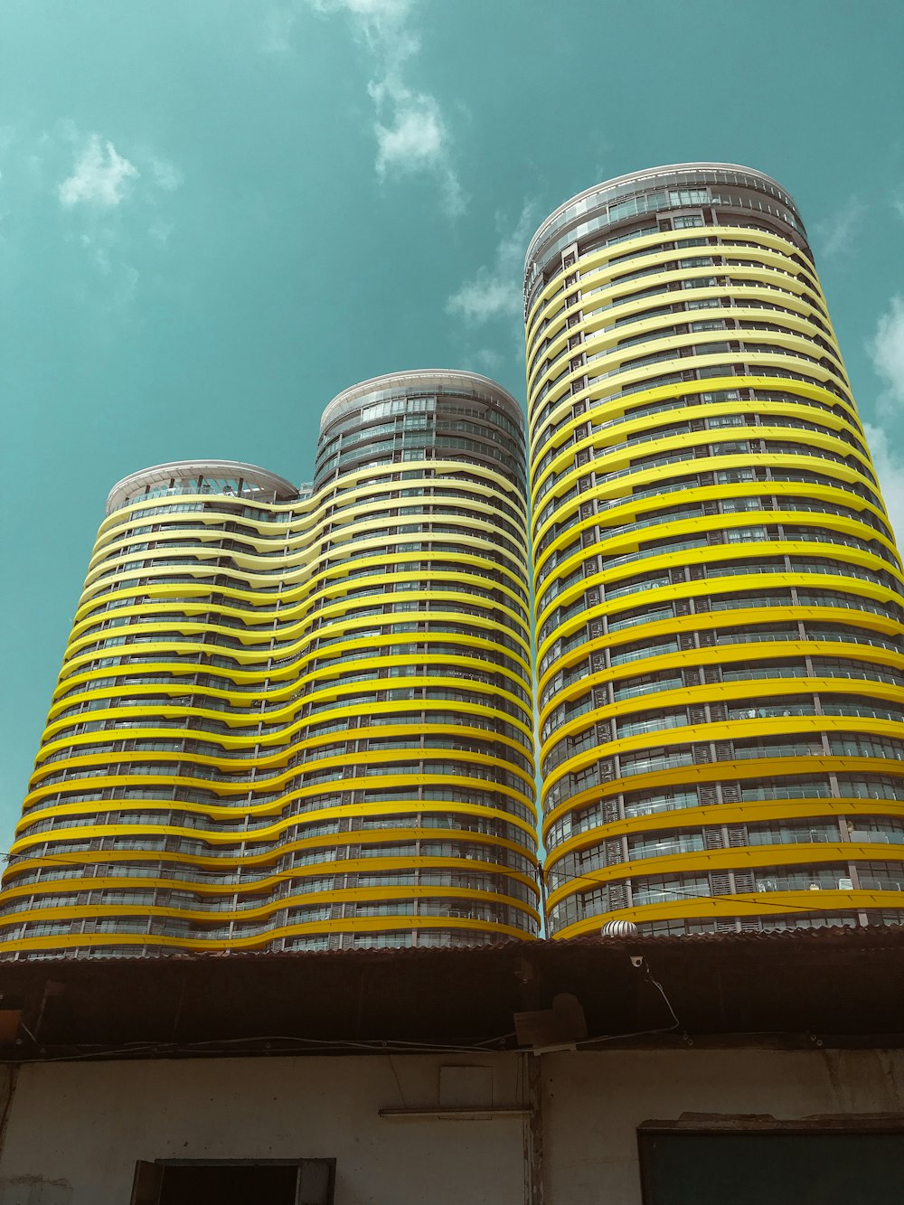 brown and white concrete building under blue sky during daytime