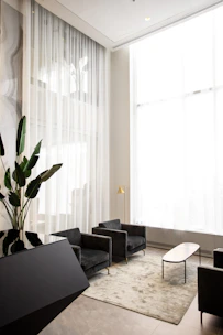 A cozy living room showcasing elegant blackout curtains in a modern minimalist style.