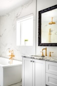 white ceramic bathtub with faucet
