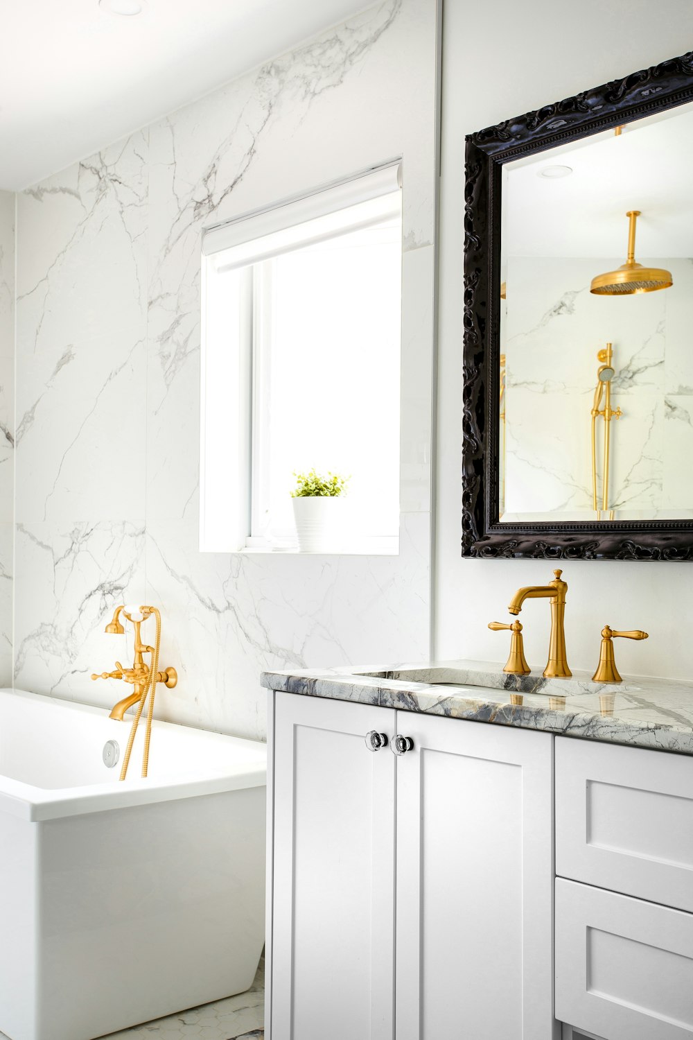 white ceramic bathtub with faucet