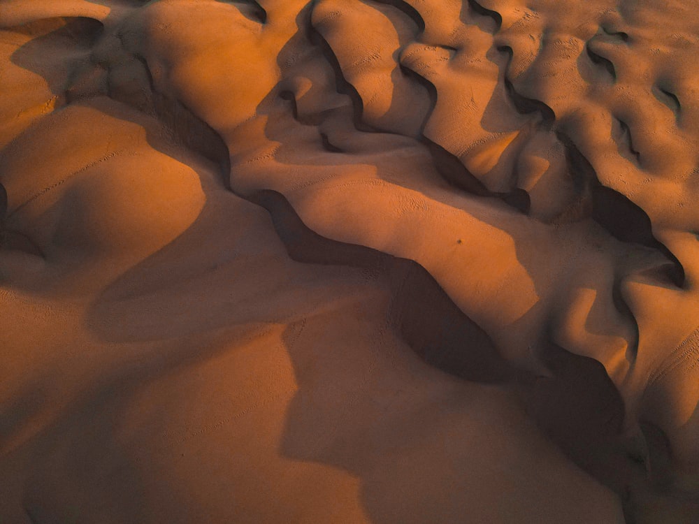 brown sand with water during daytime