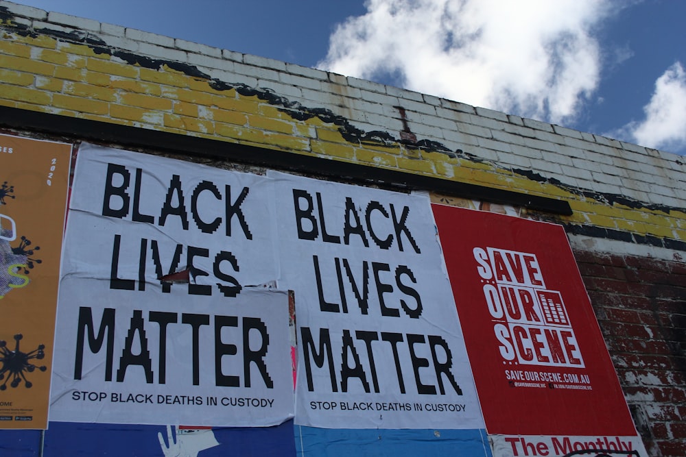 a bunch of signs on the side of a building