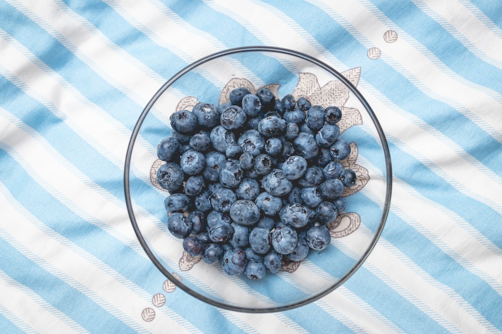 blue berries on clear glass bowl