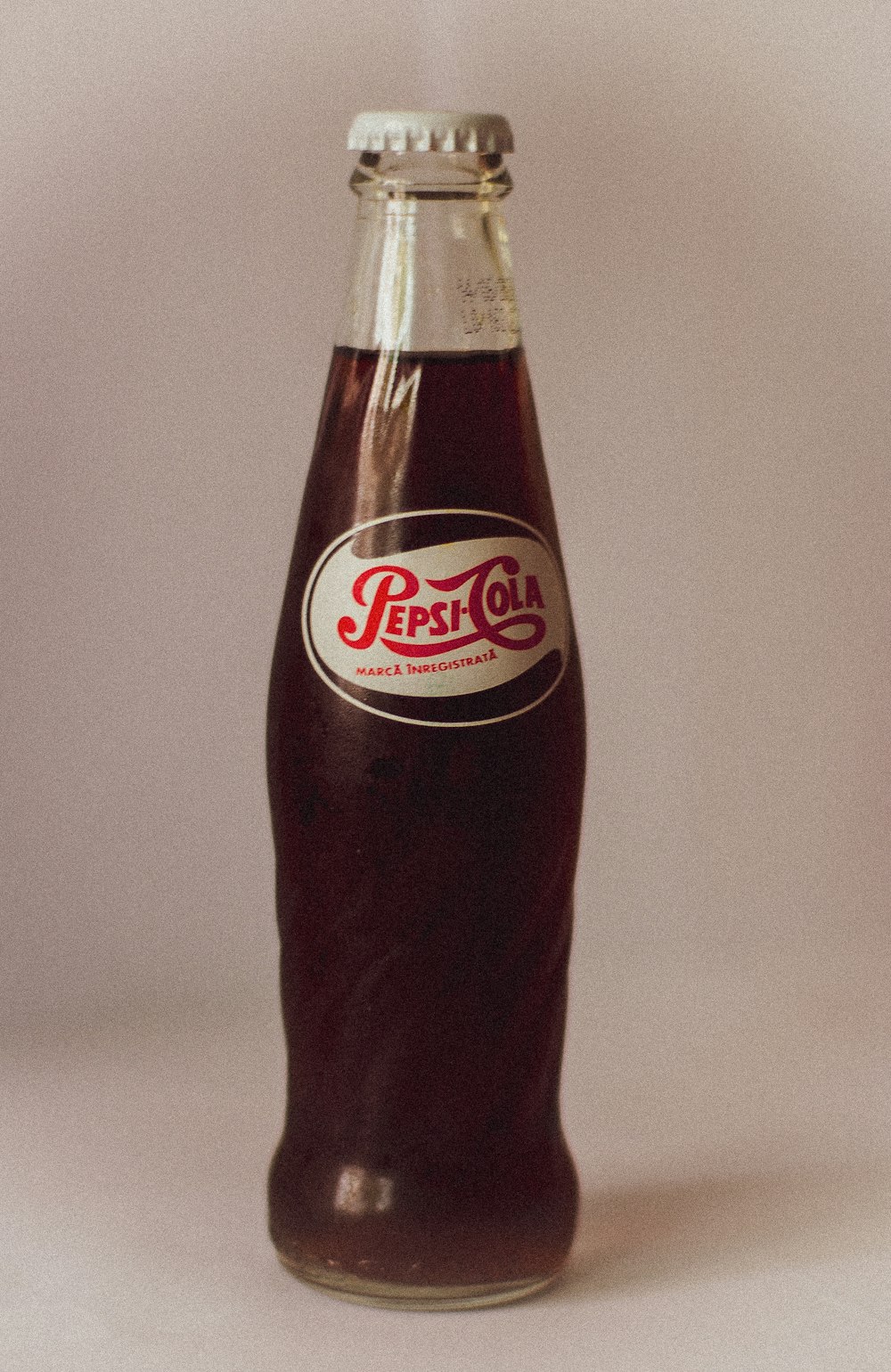 dr pepper bottle on white table