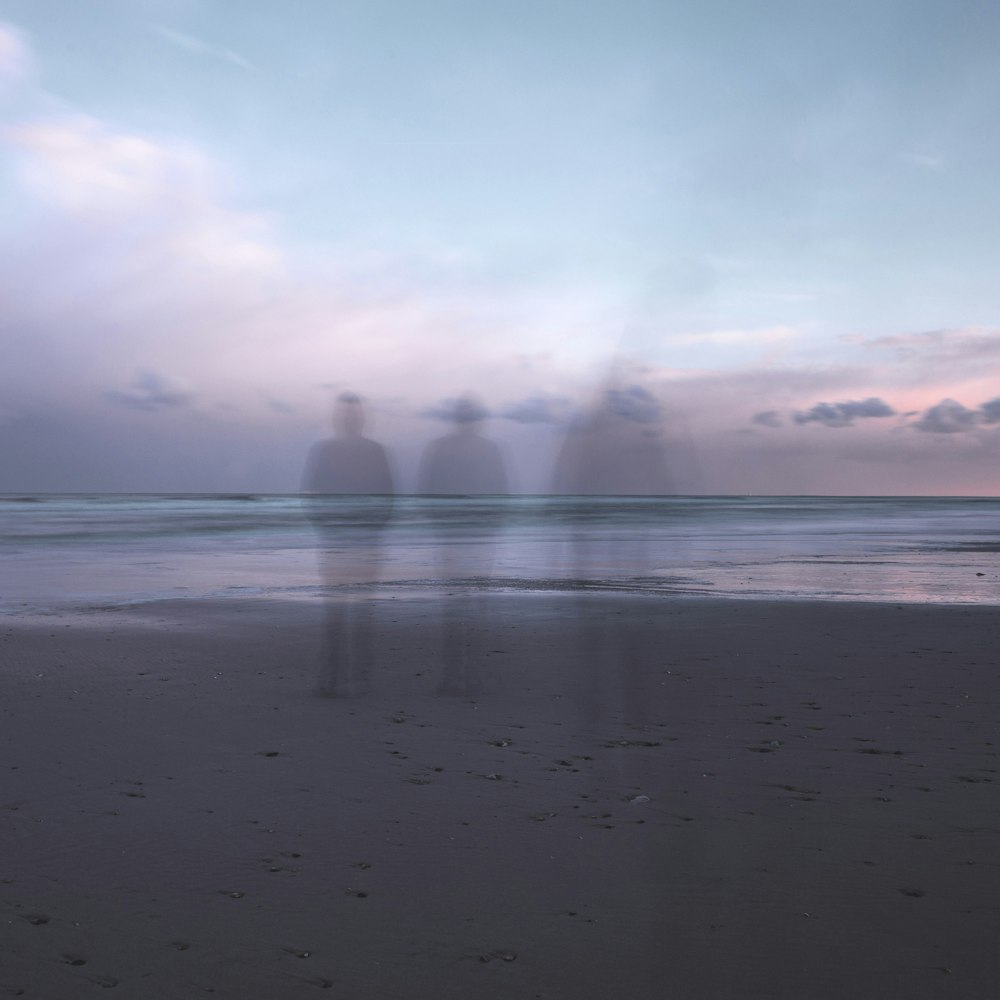 person standing on seashore during daytime