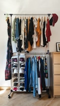clothes hanged on brown wooden cabinet