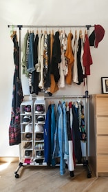 An over-the-door shoe organizer hanging on a white door, holding multiple pairs of shoes.