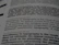 A close-up of a printed page showing text in different fonts and sizes. The visible text discusses typography, mentioning elements like attitude, planning, and the integration of design. The focus is on one sentence and the text around it is blurred.