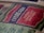 A vintage Eveready battery label featuring bold typography and a color scheme of red, off-white, and black. The label emphasizes the product's longevity with the words 'Extra Long Life Battery' prominently displayed. The texture of the paper gives a nostalgic feel.