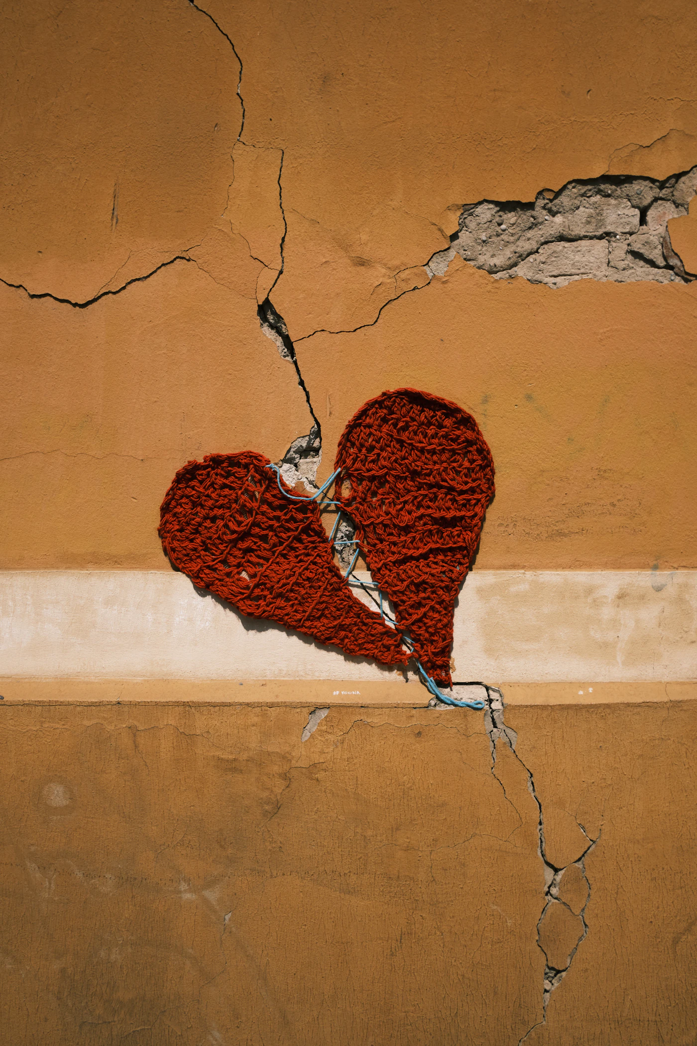 A broken heart held together, representing compassionate inner child healing