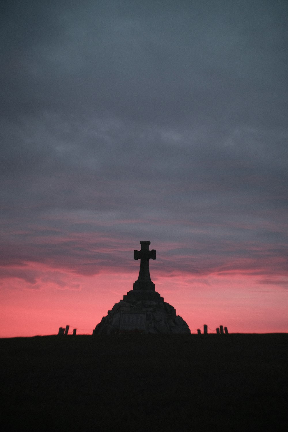 silhouette of cross during sunset