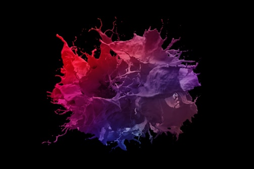 An artistic still from a video, featuring rich colors against black backdrop.