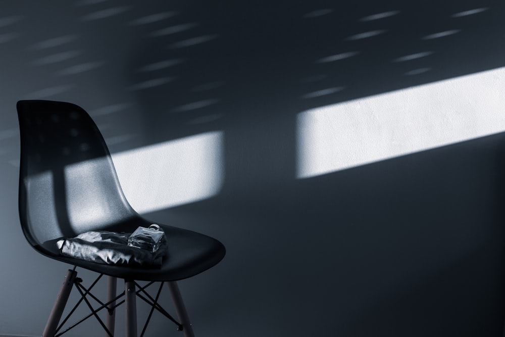 black and white high top sneakers on black chair