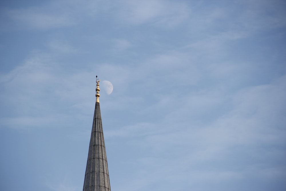 brown and white concrete building under blue sky during daytime