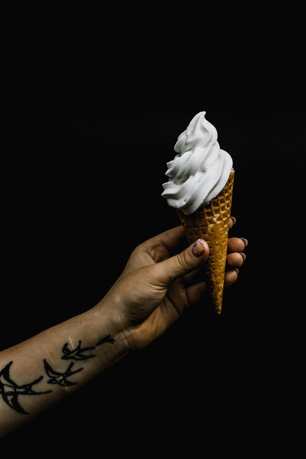 white ice cream on cone