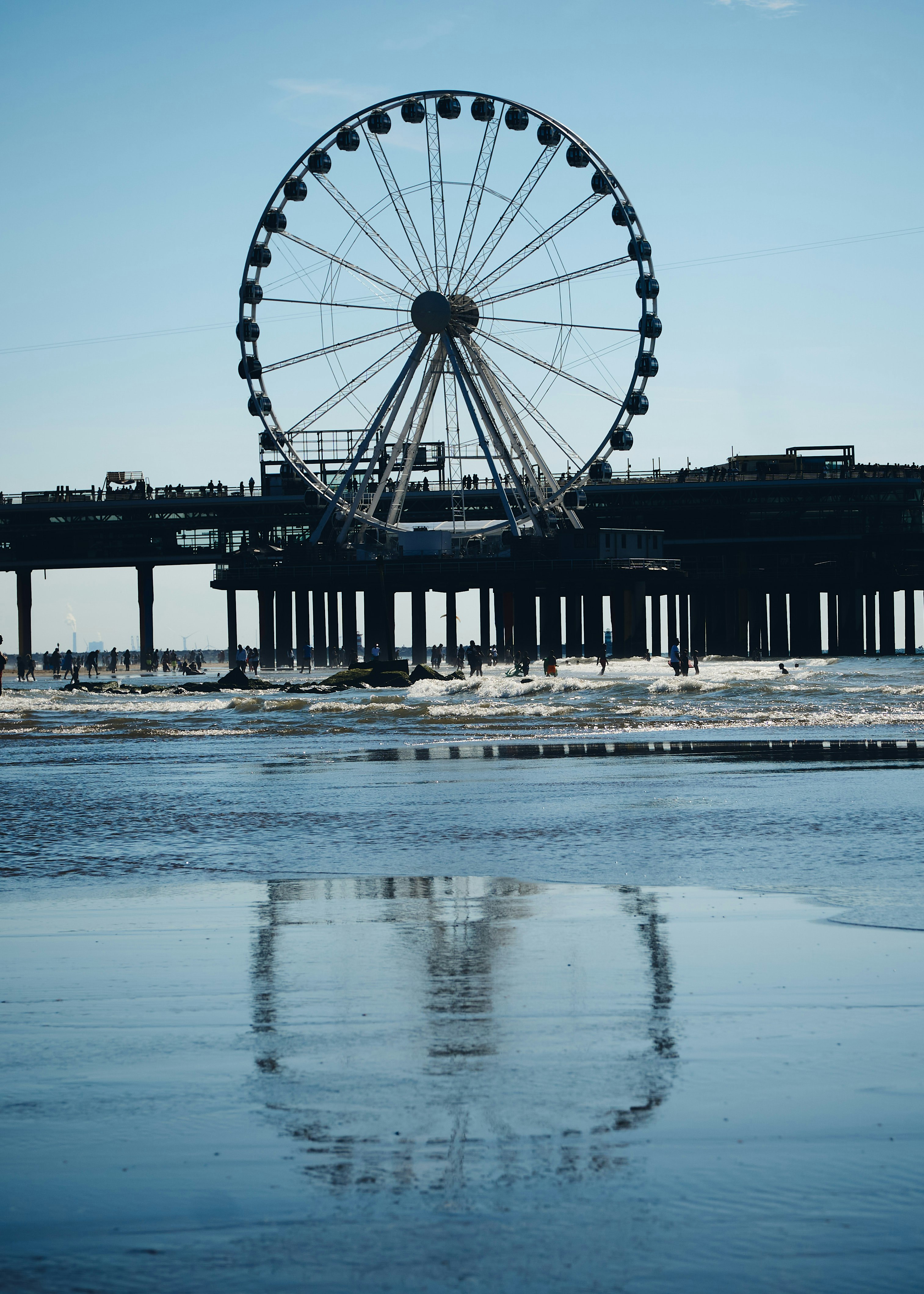 ferris wheel near body of water during daytime