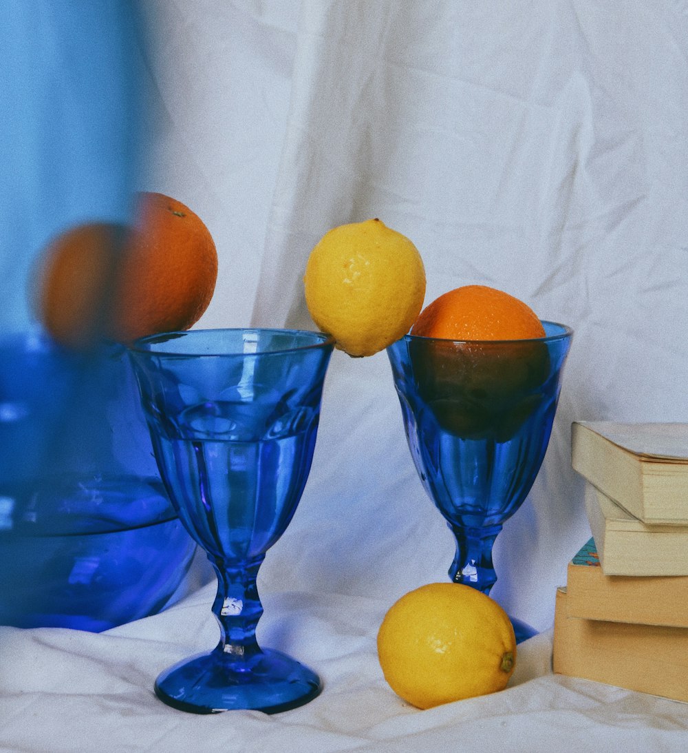blue glass cup with lemon fruit