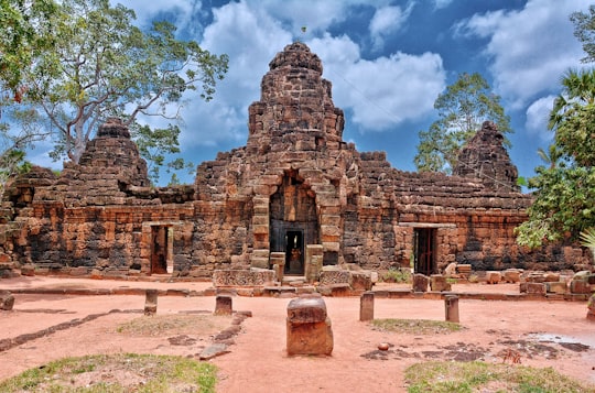 brown brick building under blue sky during daytime in Ta Prohm Temple Cambodia