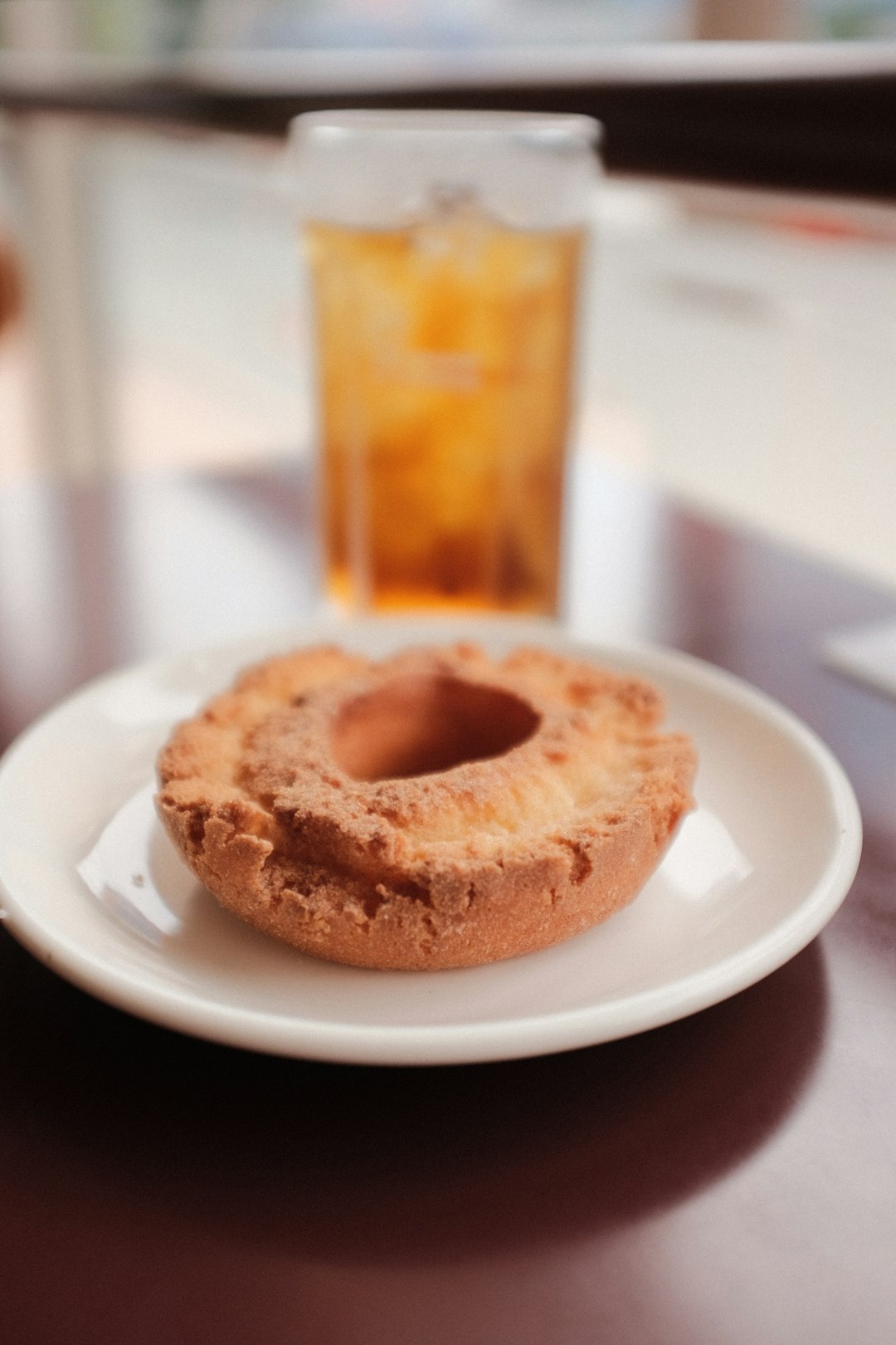 brown doughnut on white ceramic plate