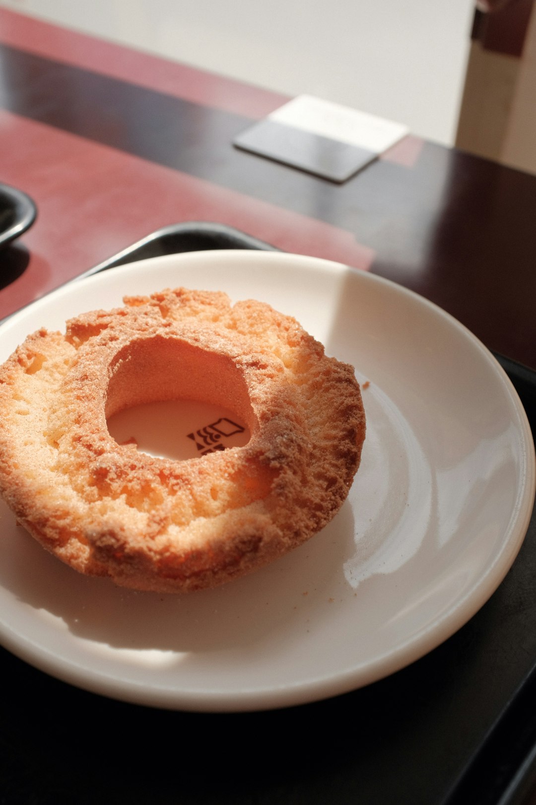 brown doughnut on white ceramic plate