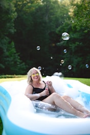 Mature woman in a bubble bath, symbolizing self-care and empowered sexual health with PrEP