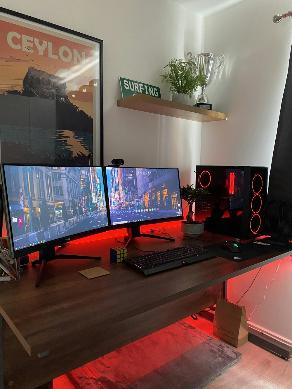 black flat screen computer monitor on brown wooden desk