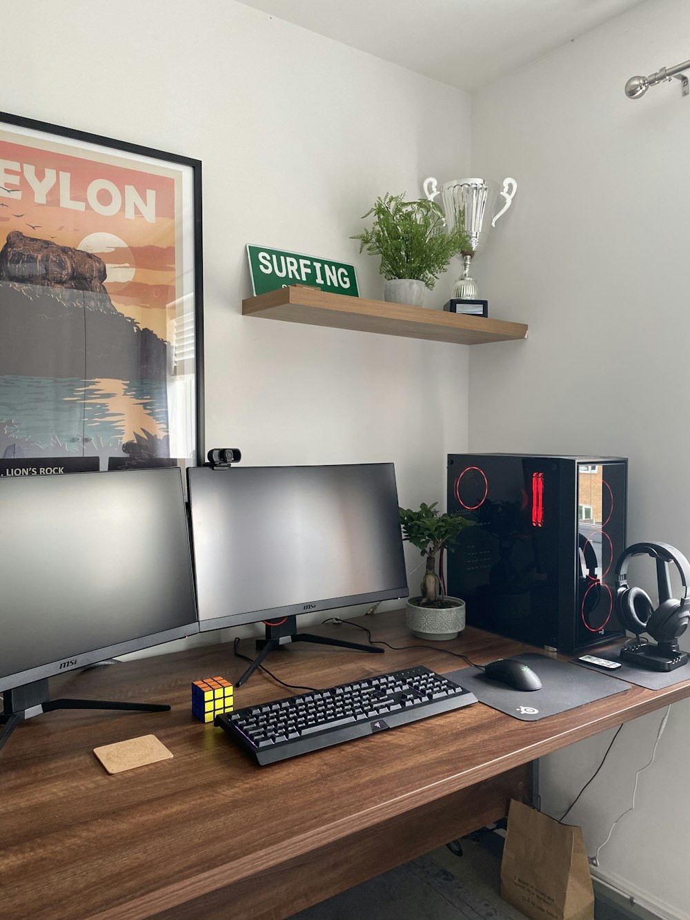 black flat screen computer monitor on brown wooden desk