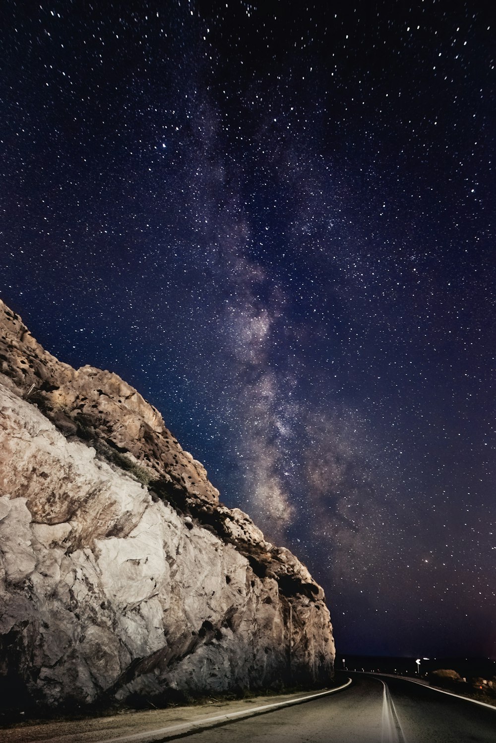 brown rocky mountain under blue sky during night time