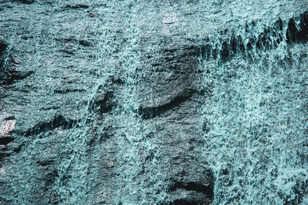 water waves on gray sand