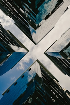 low angle photography of high rise buildings under blue sky during daytime