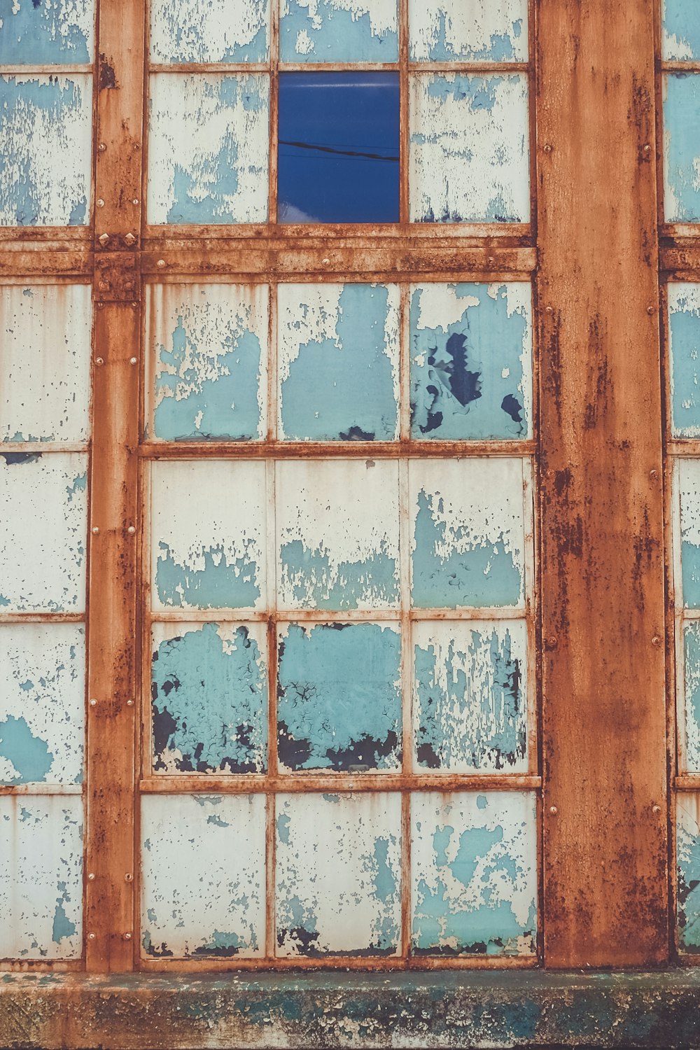 brown wooden framed glass window