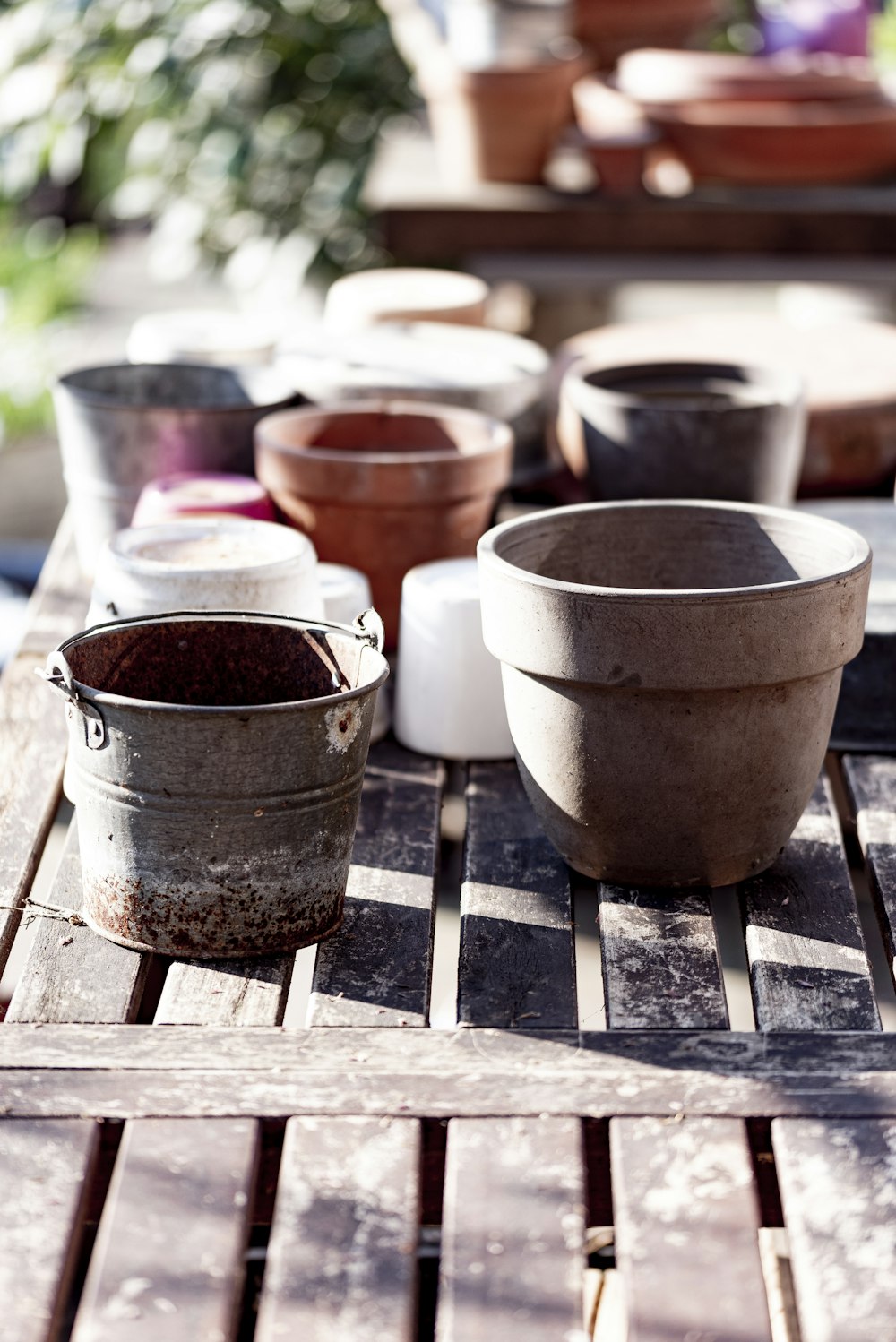 white ceramic pot on brown wooden table