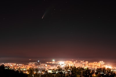 city lights turned on during night time comet zoom background