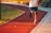 A person jogging in a park wearing comfortable activewear and headphones.