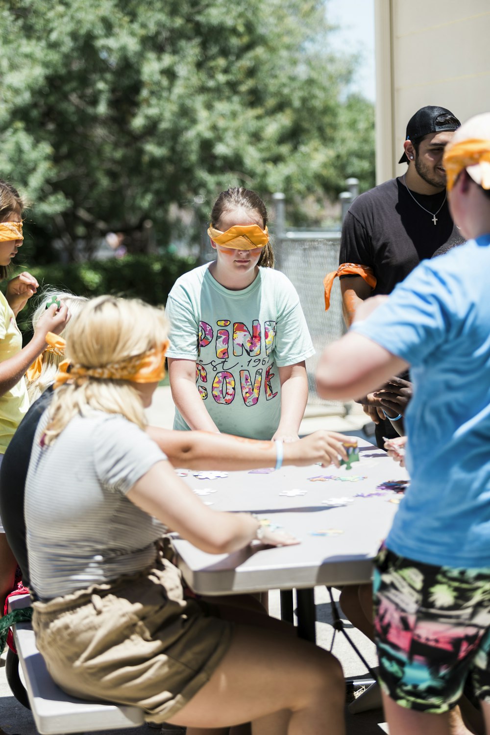 people gathering around table during daytime