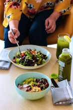 person holding silver fork and knife