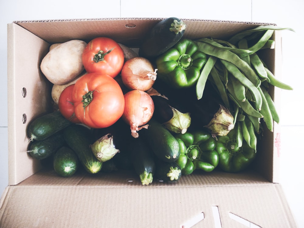 red tomato beside green chili