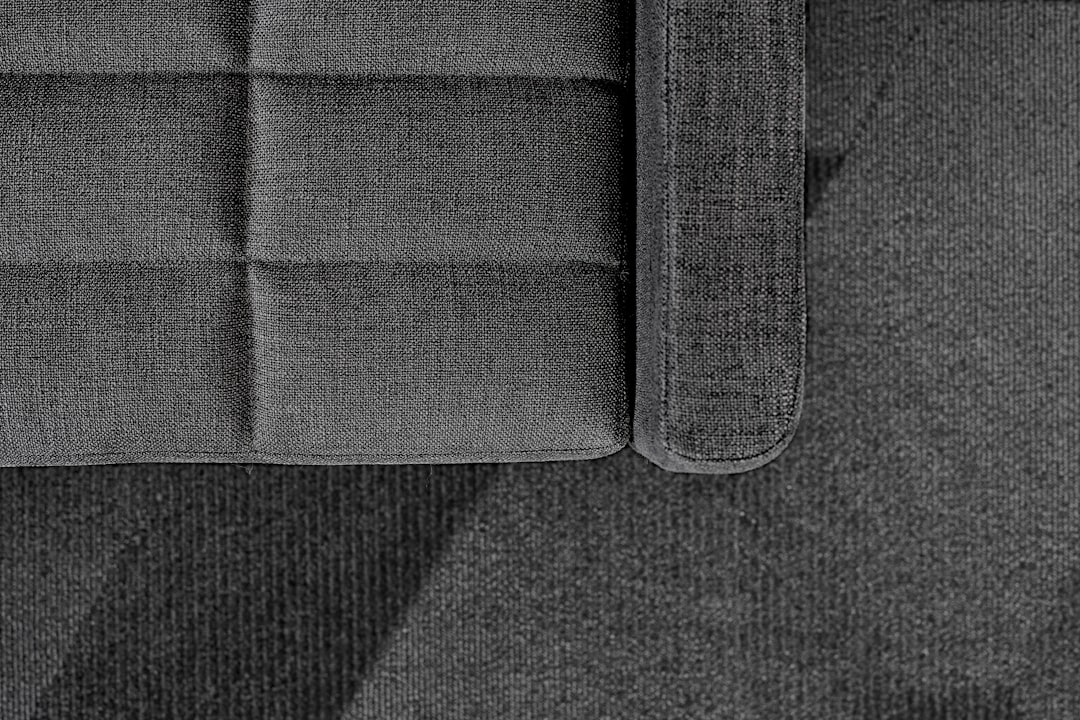 black and gray textile on brown wooden table