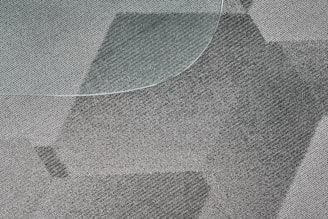 Close-up of textured vinyl flooring with a modern pattern.