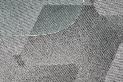 Close-up of textured vinyl flooring with a modern pattern.