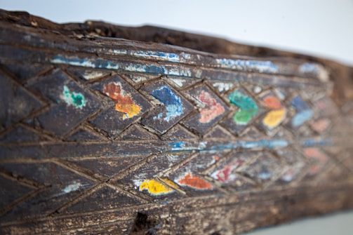 A handcrafted wooden art piece showcasing vibrant colors.